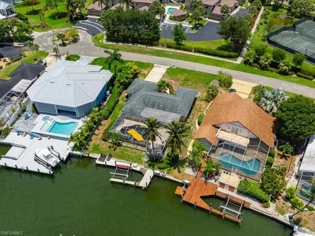 Aerial perspective of suburban area featuring a pool area