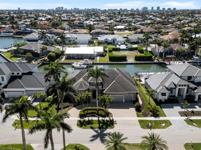 Drone / aerial view featuring a residential view and a water view