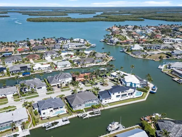 Birds eye view of property featuring a residential view and a water view