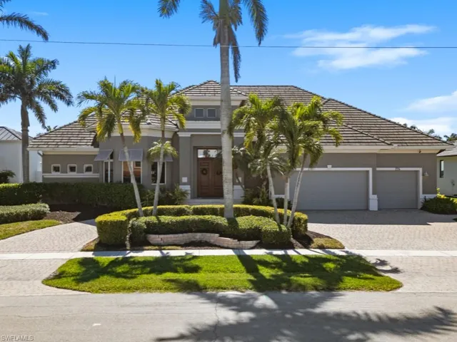 View of front of home featuring decorative driveway, a garage, and stucco siding