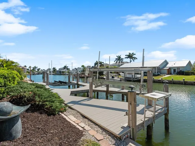 Dock area featuring a water view and boat lift