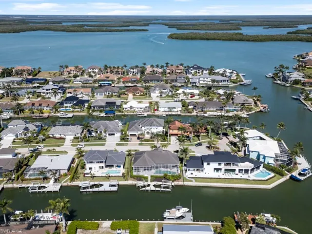 Aerial view featuring a residential view and a water view