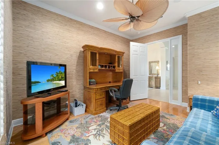 Office with ceiling fan, light wood-style flooring, baseboards, french doors, and crown molding