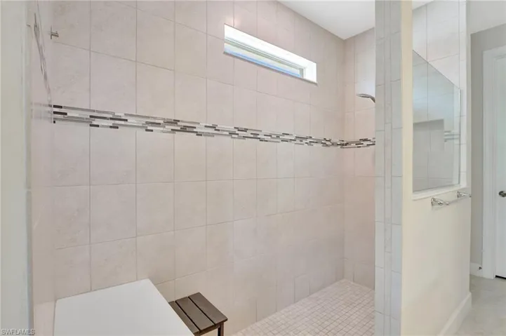 Bathroom featuring tiled shower