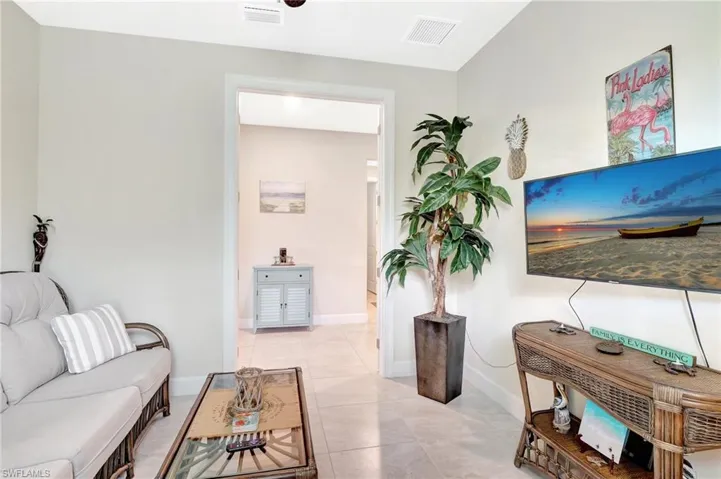 Living room with light tile patterned floors