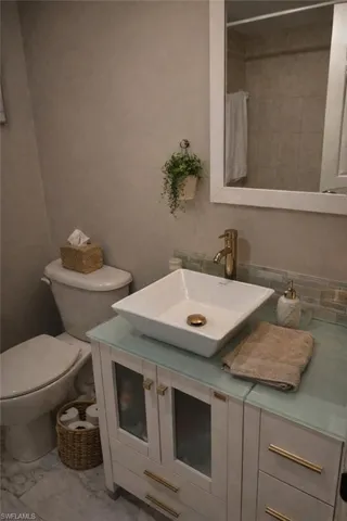 Full bathroom with vanity and a shower with shower curtain
