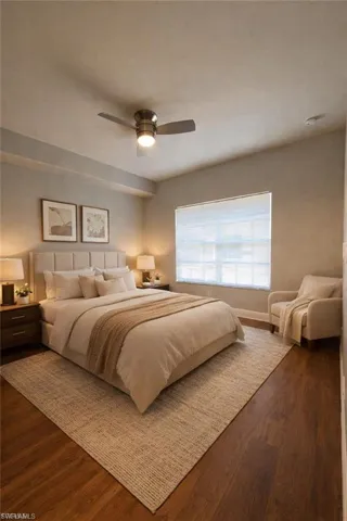 Bedroom featuring dark wood-type flooring and ceiling fan