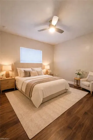 Bedroom featuring dark wood finished floors and ceiling fan