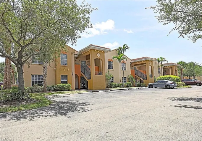 View of apartment building / complex with stairs