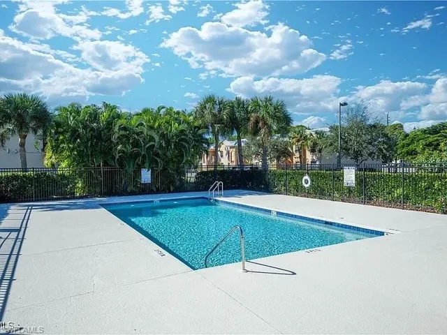Community pool featuring a patio area