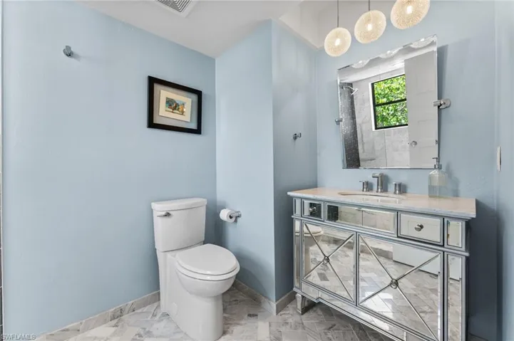Full bathroom featuring vanity and a shower