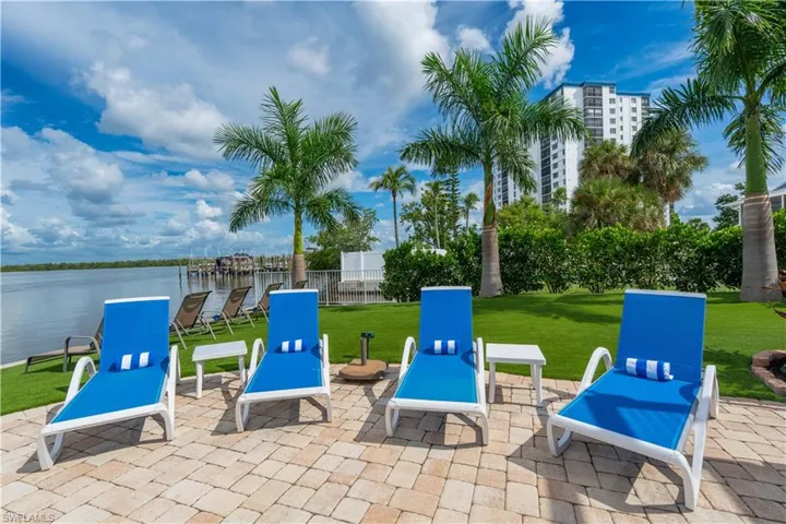 View of patio / terrace with a water view - Virtually Edited Image