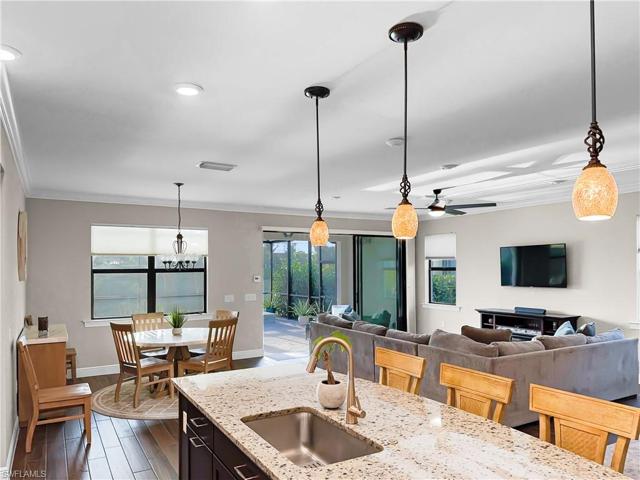 This kitchen offers plenty of space for entertaining guests with the oversize island, large dining space and breakfast nook.