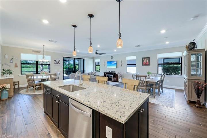 This kitchen offers plenty of space for entertaining guests with the oversize island, large dining space and breakfast nook.