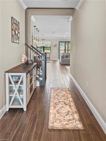 Welcoming foyer leading to the open living space.