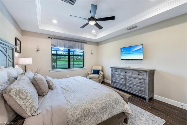 Note the tray ceilings and crown molding in the master bedroom.