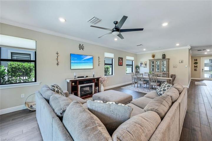 Lots of windows allow for plenty of natural light throughout the home and the wood like plank tile flooring throughout the first floor is a huge plus!