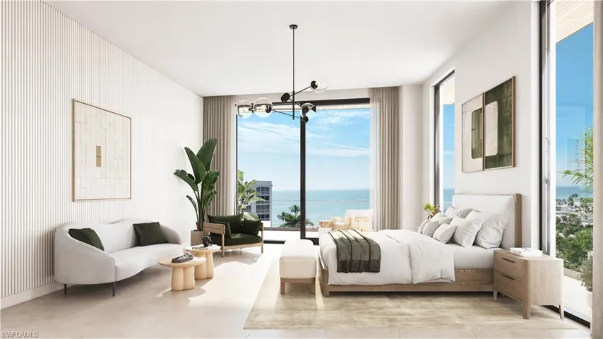 Bedroom with a water view and hanging lights