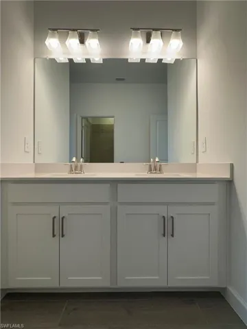 Bathroom featuring dual vanity