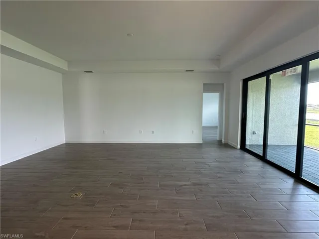Spare room with a raised ceiling