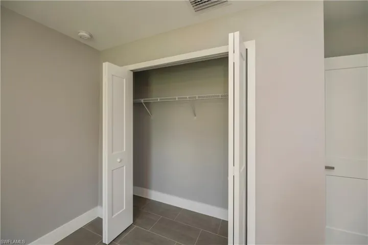 Closet featuring visible vents