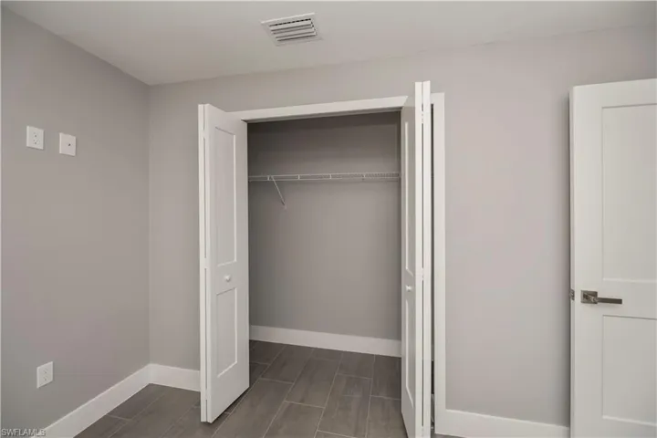 Closet featuring visible vents