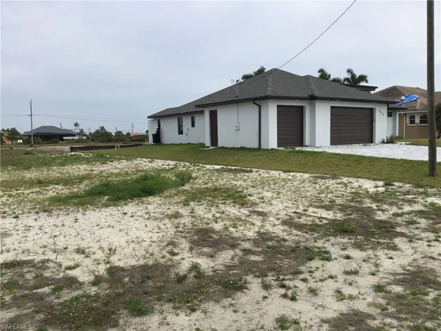 View of beautiful house to the right of the lot