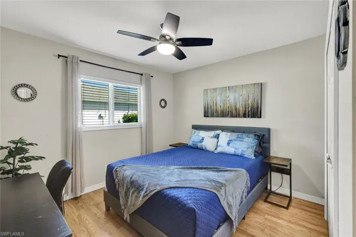 Bedroom with light wood-type flooring and ceiling fan
