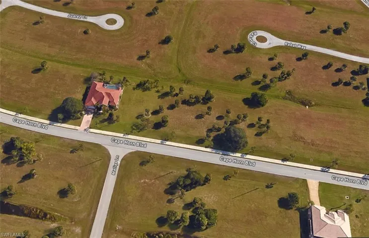 Birds eye view of property with a rural view