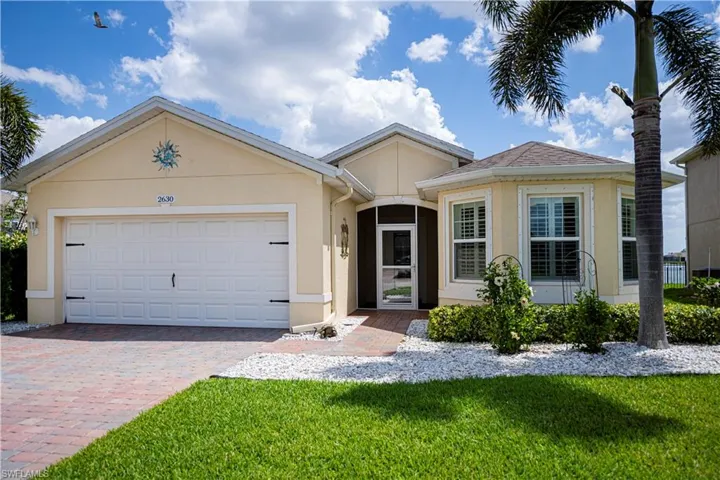 Property entrance with enclosed front porch screened door