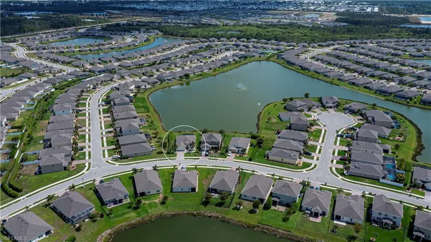 Aerial view with a residential view and a water view