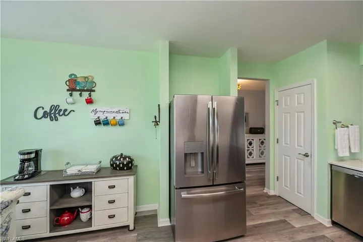 Kitchen with newer GE appliances, refrigerator with bottom cabinet freezer