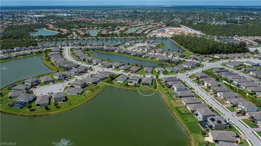 Bird's eye view with a water view and a residential view