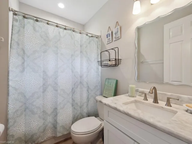 Bathroom with toilet and vanity