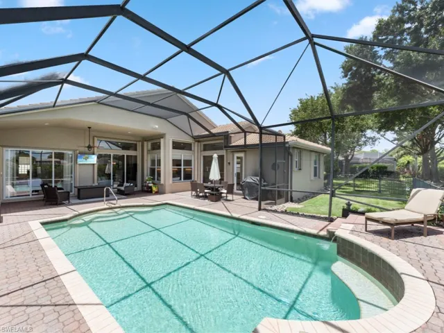 View of swimming pool featuring a patio and hangout area