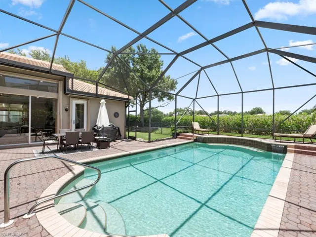 View of swimming pool with a patio, an outdoor hangout area, and a lanai