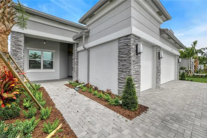 Property entrance featuring a garage