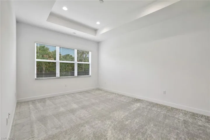 Master Bedroom with a raised ceiling