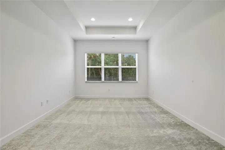 Master Bedroom with a raised ceiling