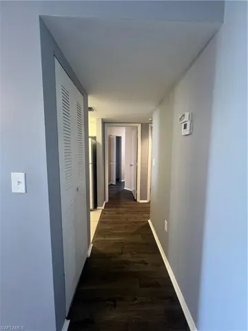 Hallway leading from living room, past kitchen to the bedrooms