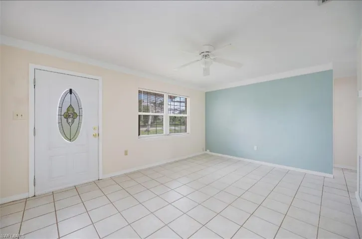 Great room with decorative glass front door