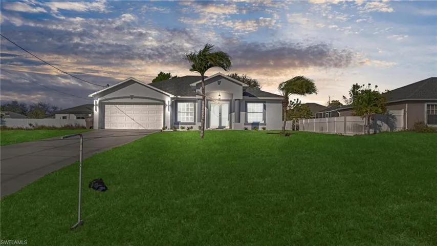 Ranch-style house with stucco siding, driveway, and a garage