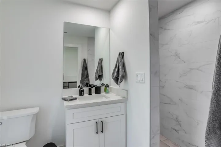 Guest Quarters bathroom with private access to pool and wetbar for hosting pool parties or private guest suite.