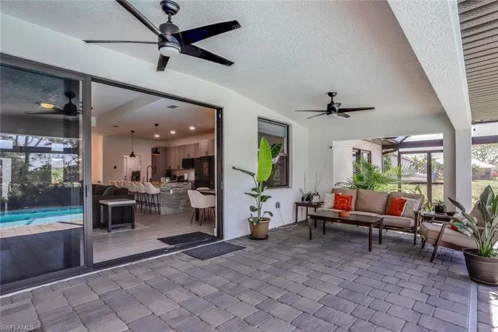 Expansive paver patio under truss and shady all day with panoramic view of wide canal and listening to nature while sipping wine or morning coffee.