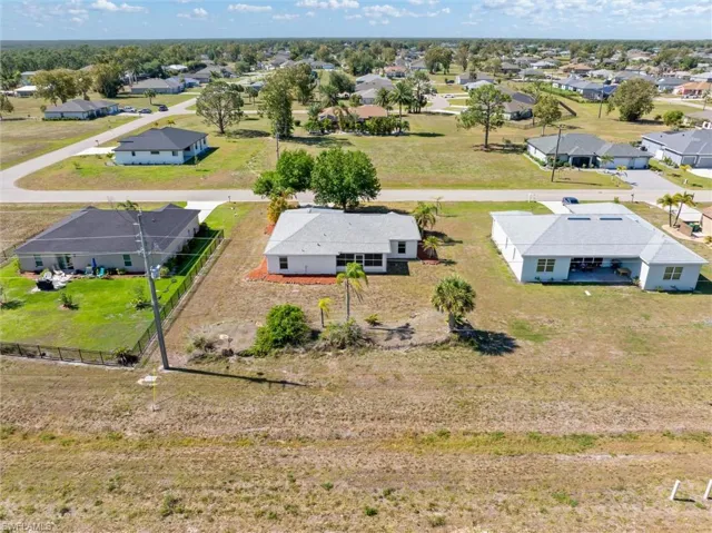 Expansive lot offering significant development potential, surrounded by established residential properties and mature trees