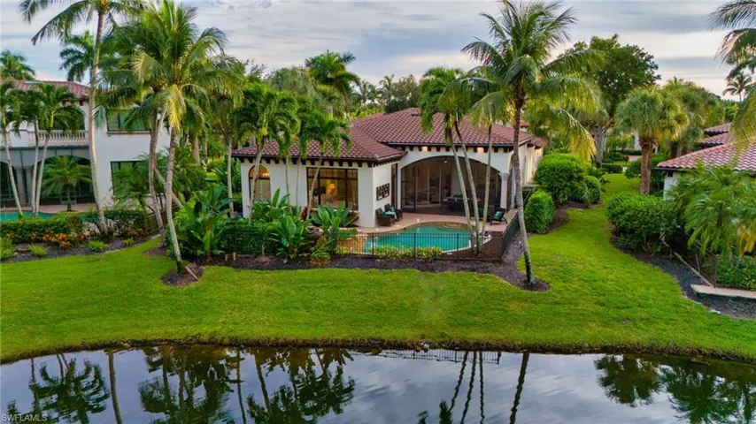 The exterior back of this residence looks out onto a peaceful lake, one of only four residences with these views.