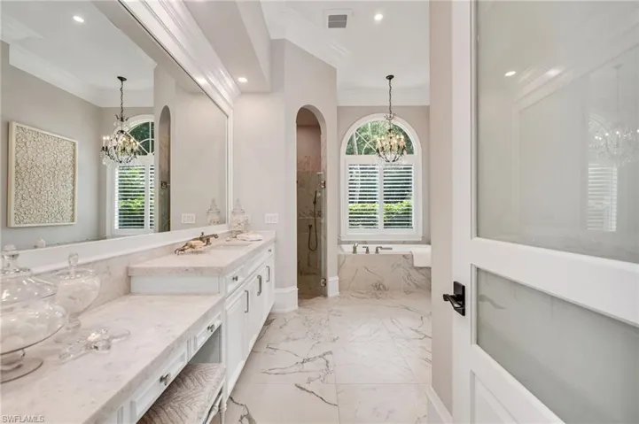 Primary bath has been redone with the utmost quality selections:  leathered, thick marble counters, all Kohler products, polished nickel hardware, a Kohler 6-foot "Le Rêve" drop-in tub, custom mirrors and woodwork surround...