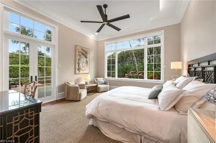 The Primary bedroom boasts of high ceilings, incredible, private views, generous moldings, wood floors, new fan, and new, Clive Daniel remote-controlled window shade.  So very inviting and calming, with serene views.