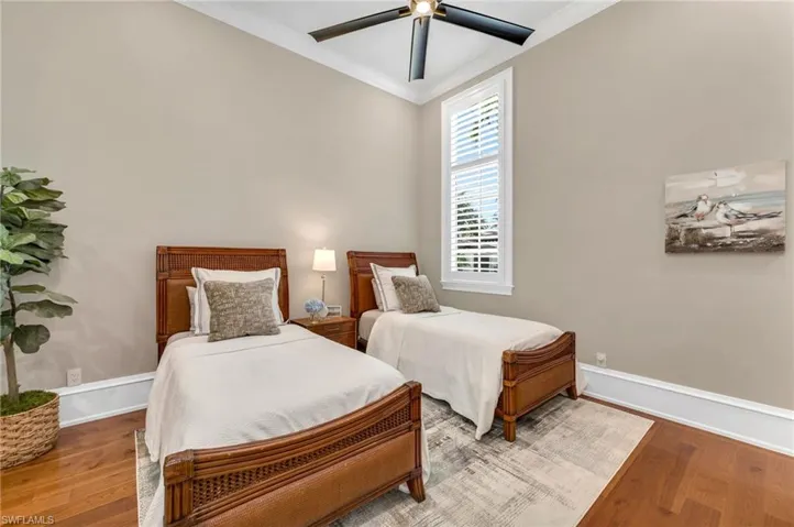 Plenty of space for grandkids...whatever their ages!  This guest suite has 12-foot high ceilings, new fan, wood floors and a huge, walk-in, custom closet.