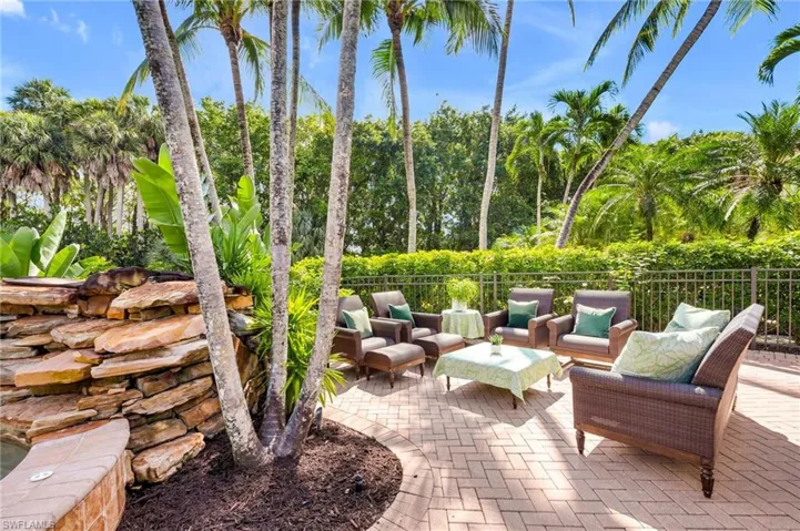 Around the back of the house, is a lovely and secluded sitting area, and the uplighting in the evening is just beautiful, as extra landscape lighting was added by the owners.